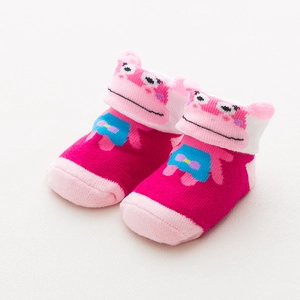 Close-up of pink cotton baby socks featuring a cute 3D hippo cartoon character on cuffs
