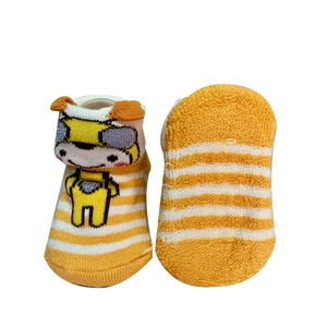 Detail view of cotton baby socks featuring yellow white stripes and cute animal pattern