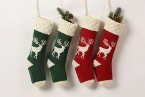 Knitted Christmas stockings with reindeer silhouette patterns in red and green set of 4
