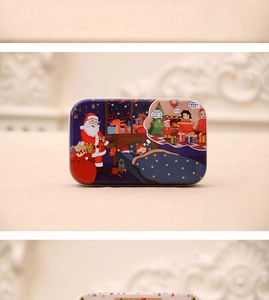Detailed view of rectangular Christmas tin boxes featuring Santa and reindeer illustrations