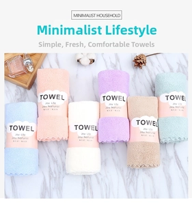 Detail view of 6-color soft coral velvet towels with elegant wavy edges and paper bands
