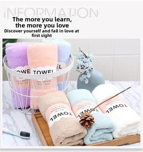 Macro detail of soft thickened coral fleece towels in various pastel colors for home use