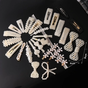 Macro detail of various pearl hair clip styles including geometric and floral designs