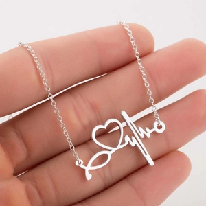 Silver stethoscope heart necklace with letter pendant on an elegant O-chain