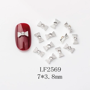 Bijoux à ongles nœud argenté avec cristal central et dimensions de 7x3,8mm