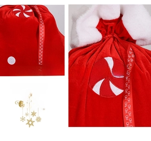 Close-up of red velvet Christmas gift bag with plush white trim and ho ho ho ribbons