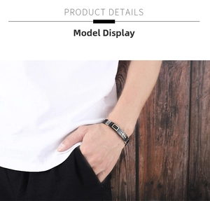 Close-up of a men's adjustable silicone cross bracelet on a model's wrist