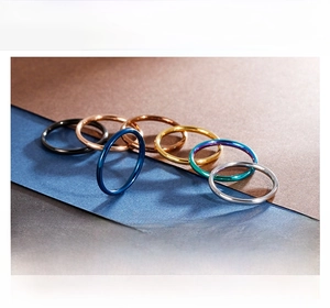 Detailed macro view of 1.1g minimalist stainless steel rings in assorted vibrant finishes