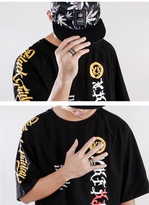 Male model wearing multi-layered stainless steel rainbow ring in black gold and blue finish