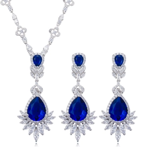 Silver bridal jewelry set featuring pear-cut blue gemstones with sparkling zircon stones