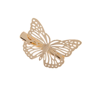 Detailed close-up of a gold hollow butterfly hair clip with a polished metallic finish