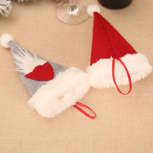 Christmas gnome cutlery holder in red and gray felt with long white beard and heart detail