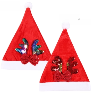 Detail of red Christmas hats with reversible sequins reindeer antlers and glitter bows