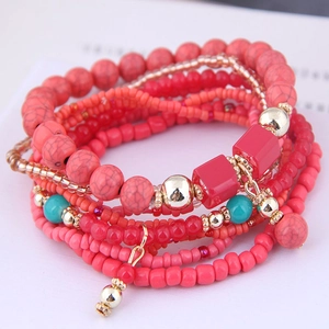 Bohemian multi-layer beaded bracelet set with pink coral marble beads and gold accents