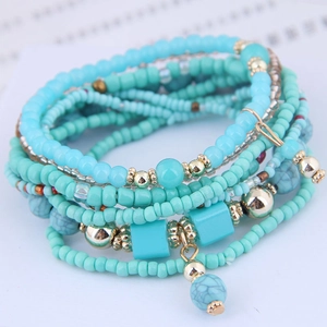 Bohemian multi-layer turquoise bead bracelet set with gold accents and marble charms