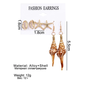 Detail of 3-piece ocean theme earring set featuring starfish shells and golden alloy