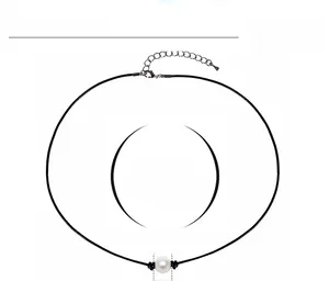Detailed view of single pearl choker necklace with 16-inch leather cord and length adjustment
