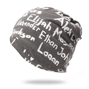 Dark grey knitted beanie with white graffiti style names for men and women