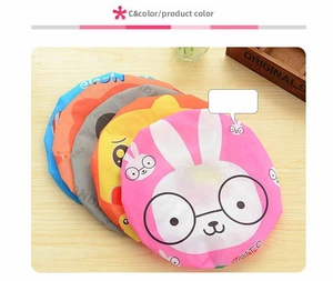 Detailed view of waterproof shower caps with elastic edges and cute animal patterns