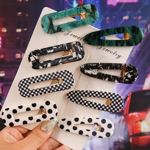 Handheld set of 8 geometric marble and checkerboard patterned hair clips for women