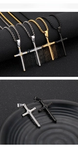 Detail of cross pendants with scale texture and star motif in four metal colors