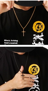 Detail of gold and black wrapped cross pendants on twisted rope chains for men