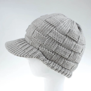 Close-up of light grey cable knit baseball cap with stiff brim on a white mannequin head