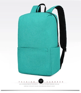 Detail view of turquoise casual travel backpack showing side zipper and durable fabric texture