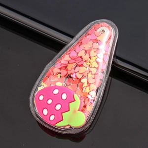 Detail of a transparent water-drop BB clip with pink sequins and a strawberry motif