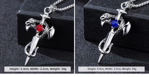 Macro shot of gothic dragon sword pendants with red and blue gemstones, 5.4cm size detail