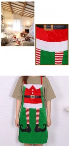 Detailed close-up of festive Santa-themed Christmas kitchen apron with plush fabric texture
