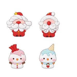 Set of four cute resin Christmas ornaments featuring Santa Claus and snowman characters