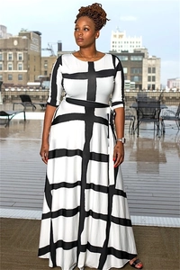 Outdoor view of elegant black and white geometric pattern maxi dress with half sleeves