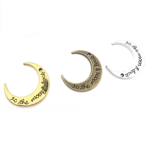 Celestial crescent moon pendants with to the moon and back engraving in three metallic colors