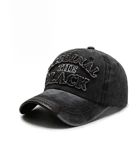 Detail of vintage washed baseball cap with 3D embroidery and brown leather brim