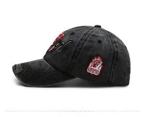 Detail view of washed black baseball cap with vintage embroidery and NYR side patch