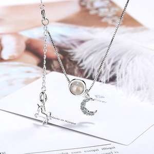 Silver unicorn moon necklace with moonstone pendant for women in a minimalist style