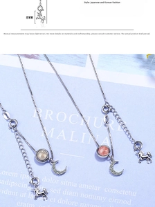 Detail view of unicorn necklace showing 8mm moonstone pendant and crescent moon charms