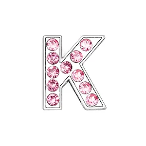 Detailed view of silver chrome letter K pendant with pink rhinestones for DIY jewelry