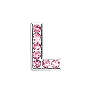 Detail of letter L charm featuring shiny pink rhinestones and chrome finish metal