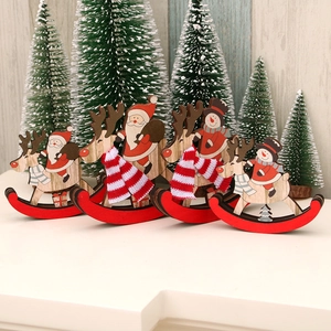 Set of four wooden rocking horse Christmas ornaments featuring Santa and Snowman