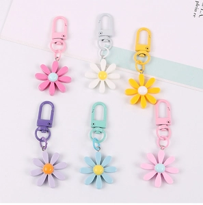 Colorful daisy keychain charms with metal D-buckles in six pastel macaron colors