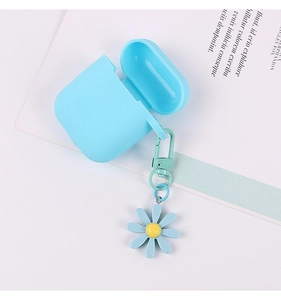 Detail of light blue silicone AirPods case with daisy pendant on white background