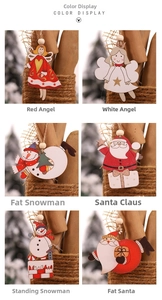 Détails d'ornements de Noël en bois peints à la main avec figurines de Noël