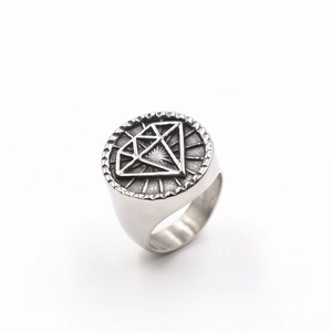 Detailed view of vintage silver steel ring featuring embossed diamond-shaped logo pattern