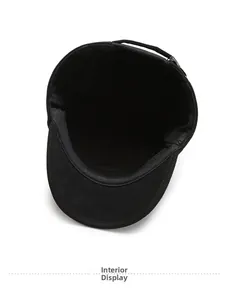 Detail of the warm interior lining and stitching of a black winter flat cap for men