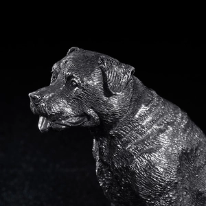 Artistic vintage stainless steel dog sculpture with realistic metallic texture on black background
