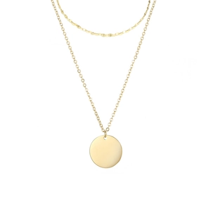 Macro detail of double-layer gold plated necklace featuring a round smooth pendant