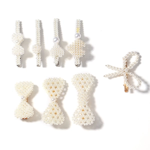8-piece set of elegant pearl hair clips with bows and hearts on a white background