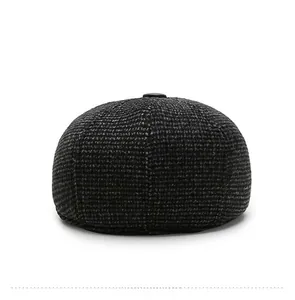 Rear view of grey plaid driving hat showing detailed wool texture and top button